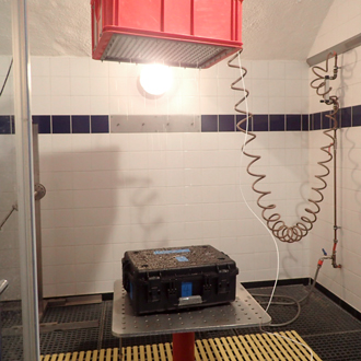 SINORA suitcase is artificially sprayed with water during water resistance test